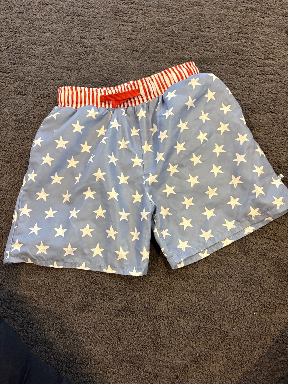 Like new Caden Lane Kids Blue Star Print Swim Shorts with Red Stripe Waistband